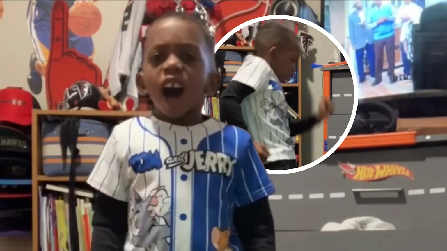 Child in Tom and Jerry shirt in bedroom