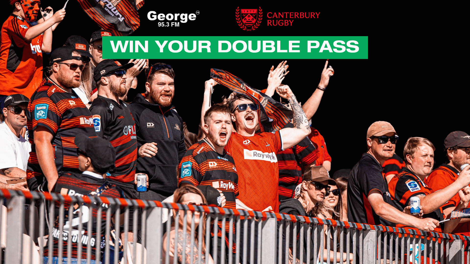 A vibrant crowd of rugby fans in red and black jerseys cheers loudly in stadium stands, with "WIN YOUR DOUBLE PASS" and "Canterbury Rugby" logos at the top.