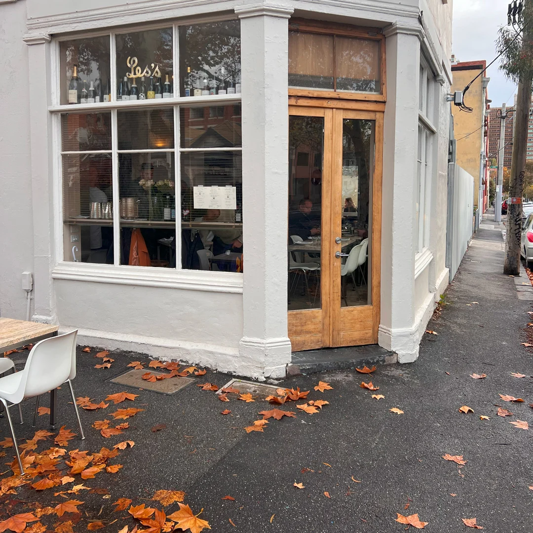 Corner restaurant - Carnation Canteen in Melbourne - with autumn leaves on pavement