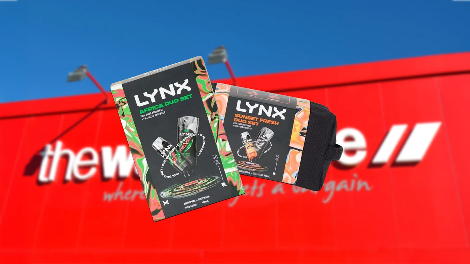 Blurred picture pf the warehouse with two lynx africa gift packs in front of it.