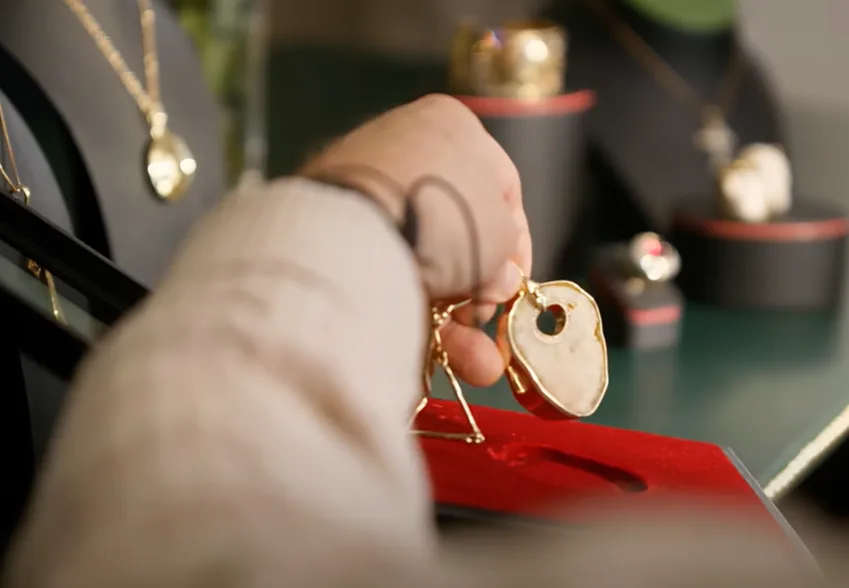 A gold necklace made with Elton John's old kneecap.