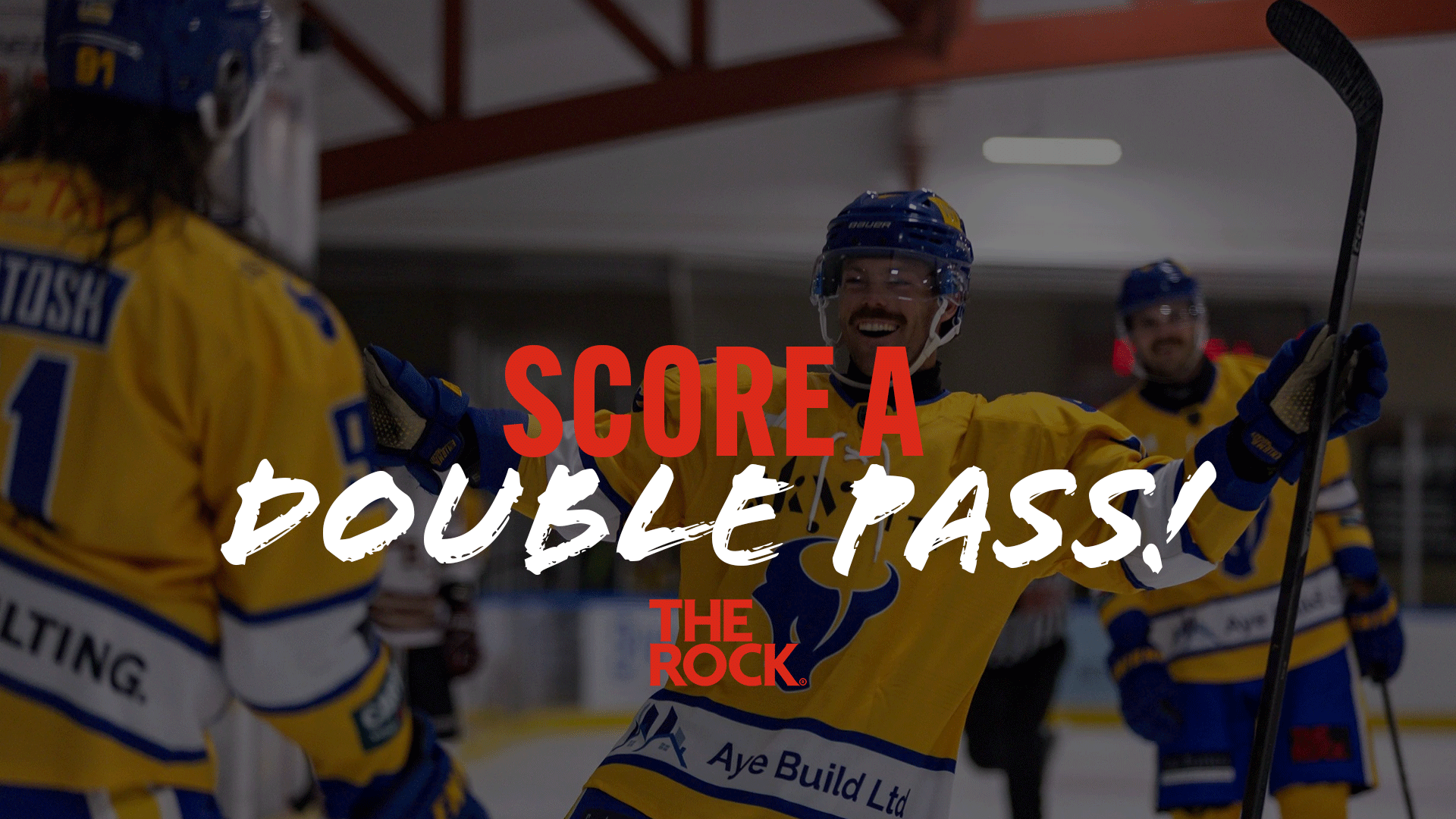 Two smiling hockey players in yellow and blue jerseys celebrate on the ice rink, with "SCORE A DOUBLE PASS!" text overlay.
