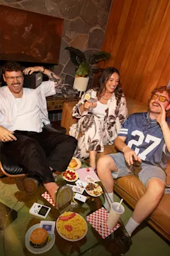 Sean, Steph & Harrison sitting in lounge laughing together