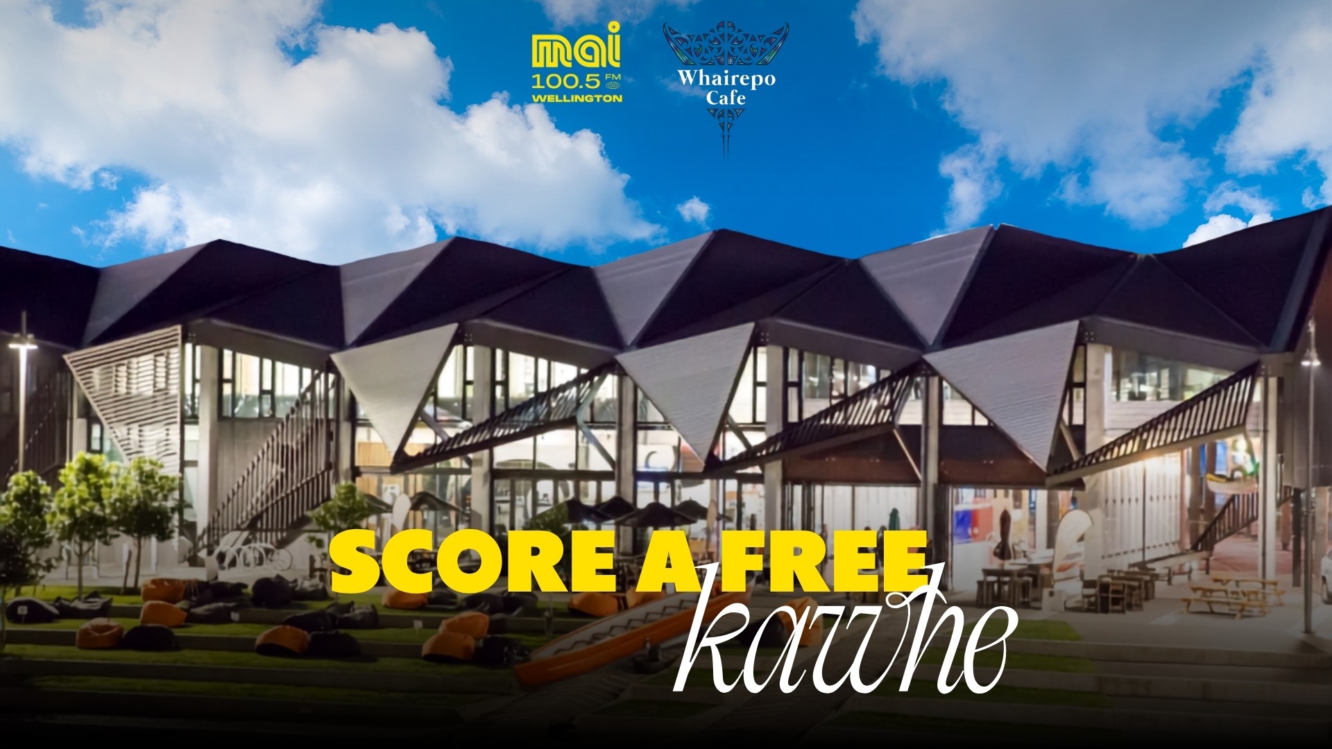 A modern building with an angular roof and large windows, fronted by an outdoor area with beanbags; text "SCORE A FREE kawhe" and logos for Mai 100.5 FM and Whairepo Cafe are overlaid.