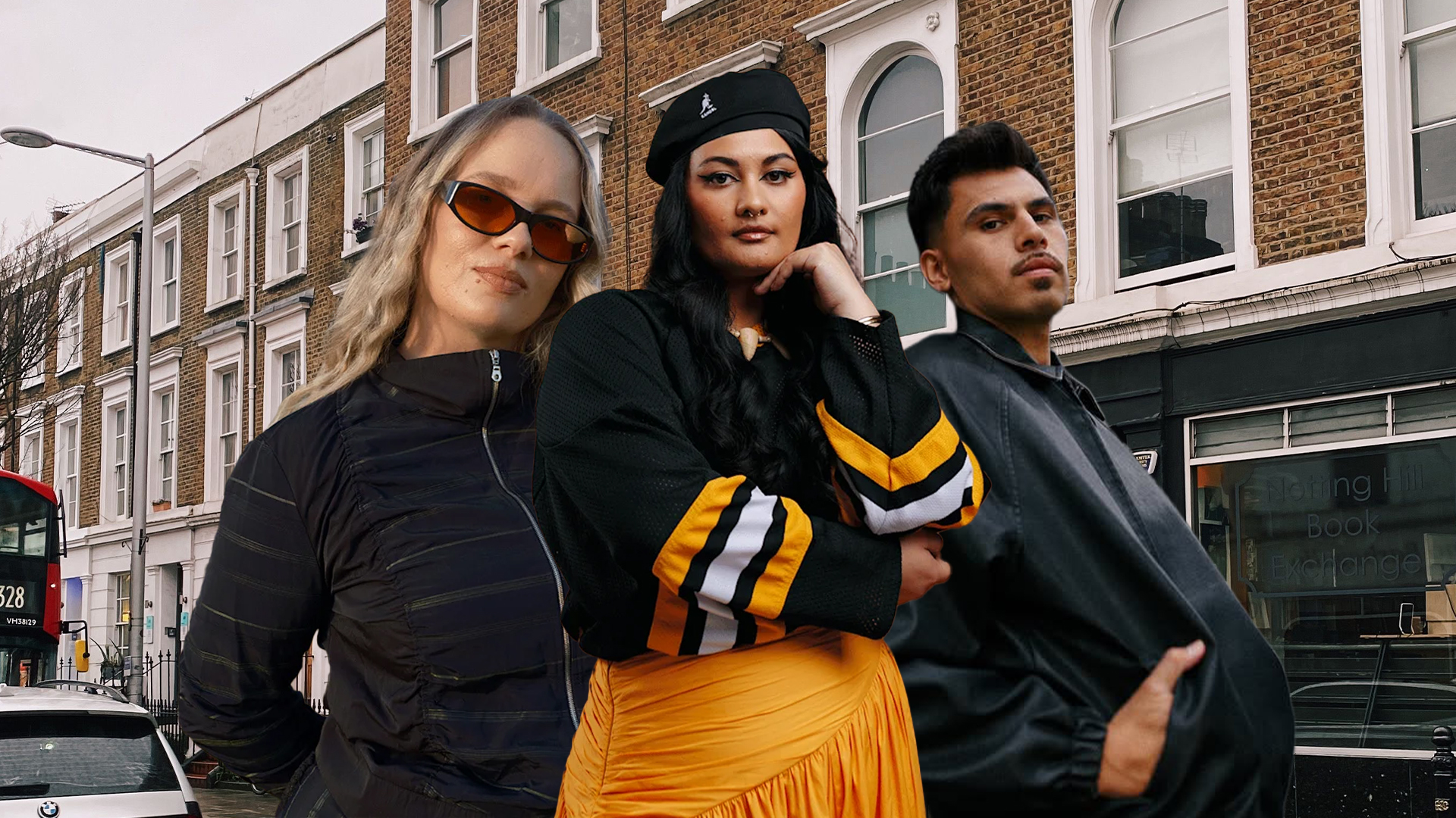 Three people, two women and one man, stand posing on a street with brick buildings and a "Notting Hill Book Exchange" sign in the background. A red bus is on the left.