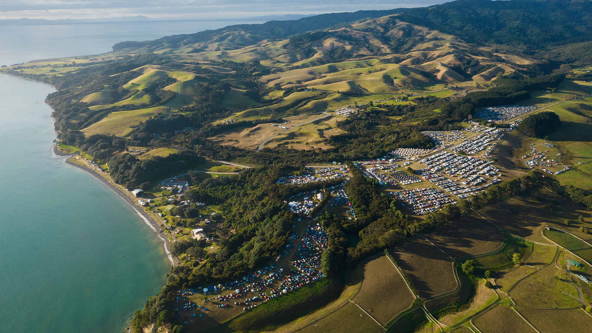 Drone shot of Tāpapakanga Regional Park over Splore 2024