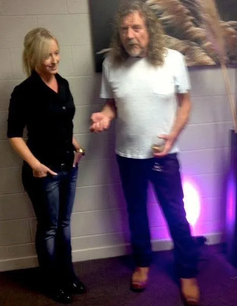 Robert Plant and Tracey Donaldson are smiling and having a chat after a show.