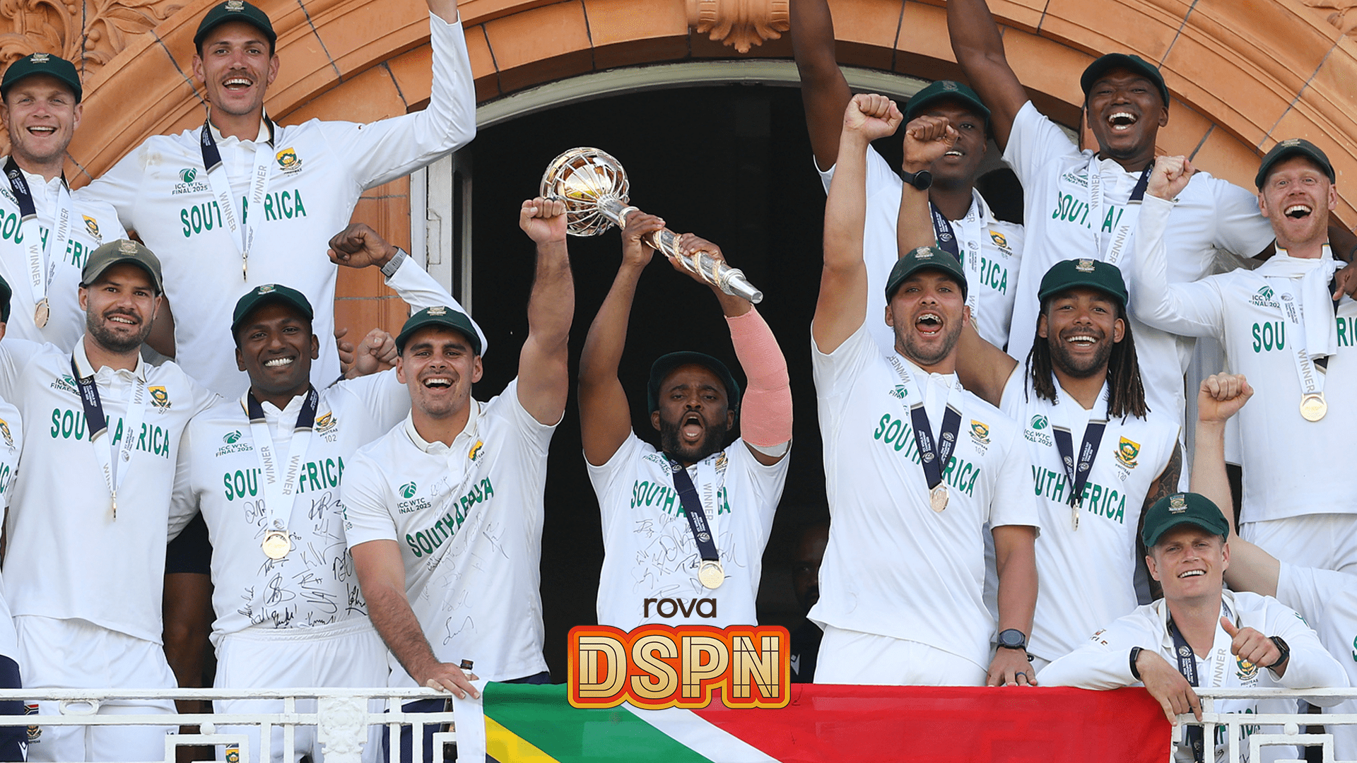 Cricket team celebrating with trophy
