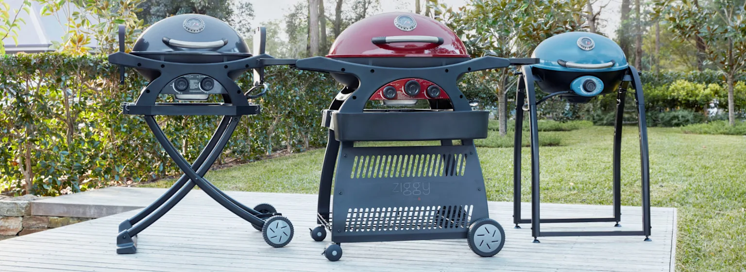 Three BBQ grills in black, red and blue
