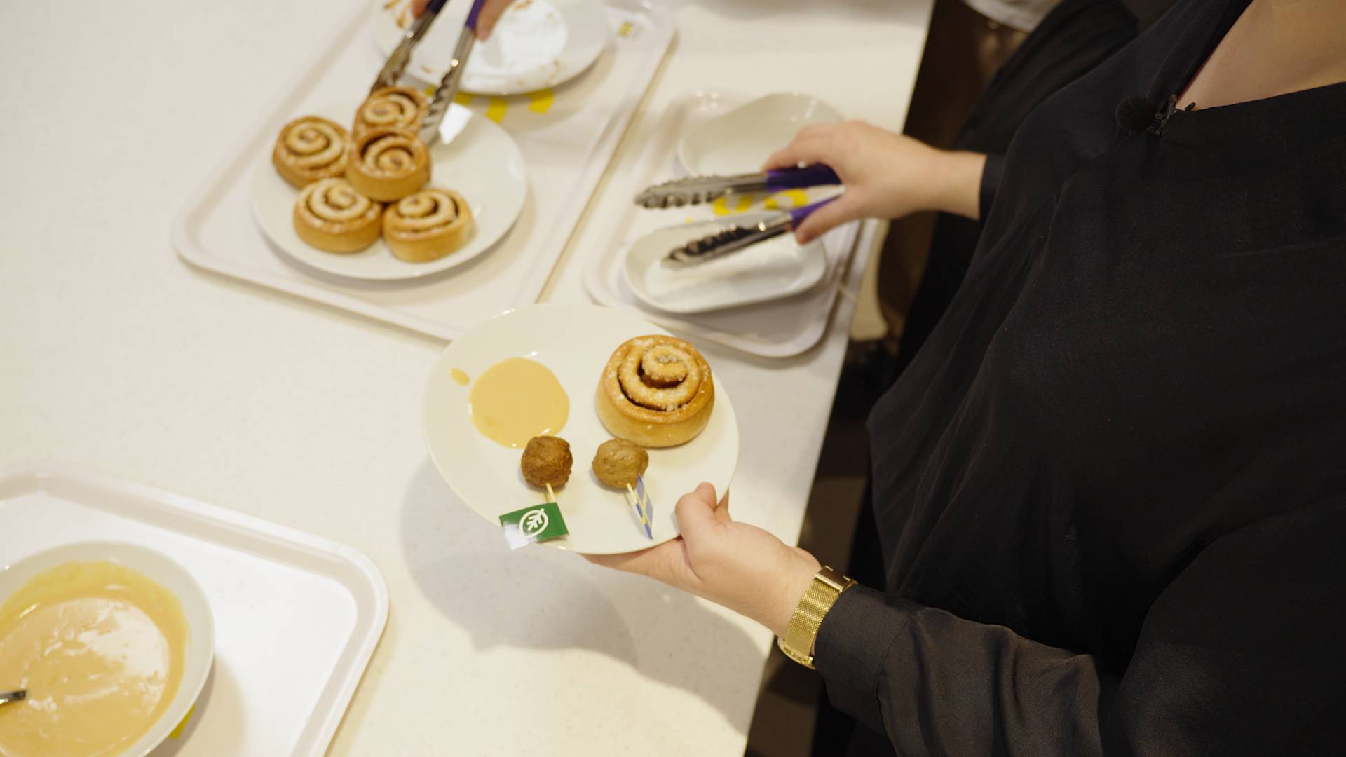 IKEA meatballs and cinnamon roll on a plate 
