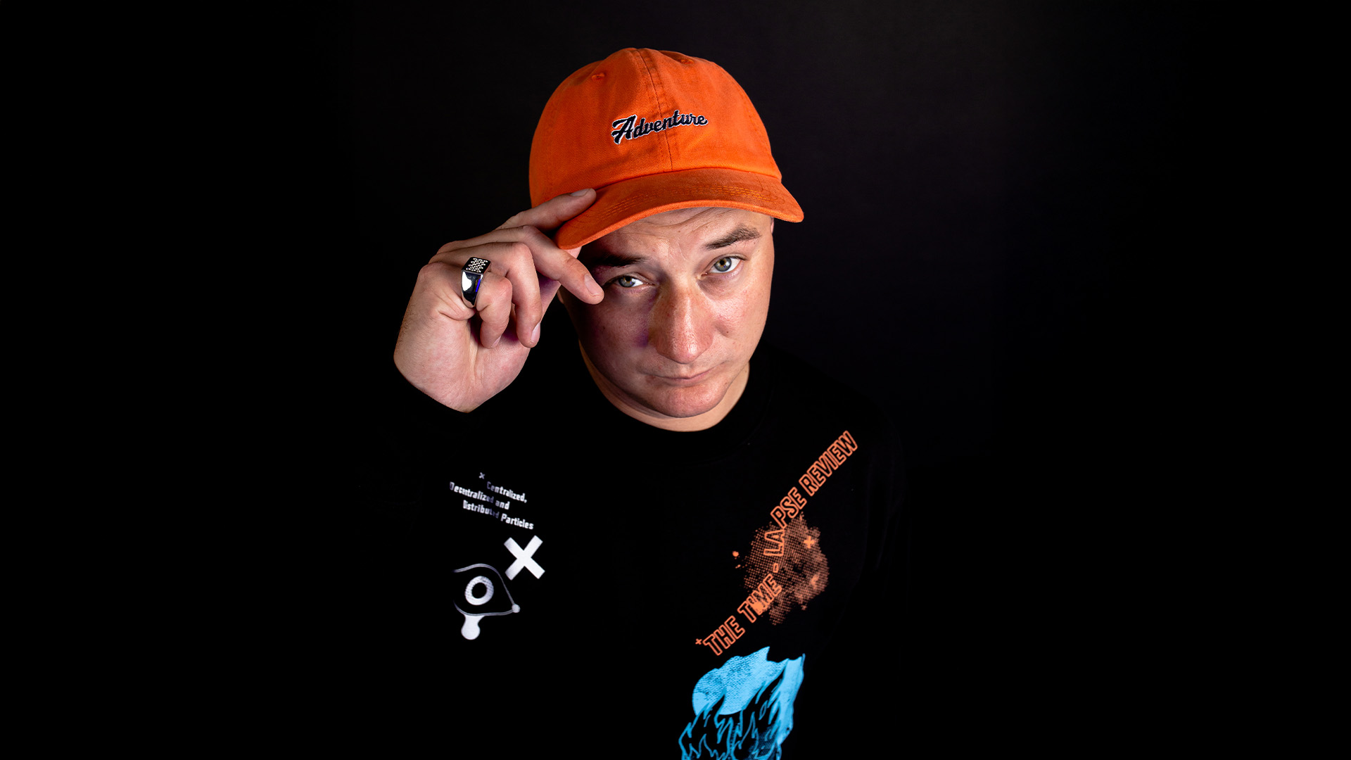 The Rock logo on top of a black and white image of a crowd at a rock concert