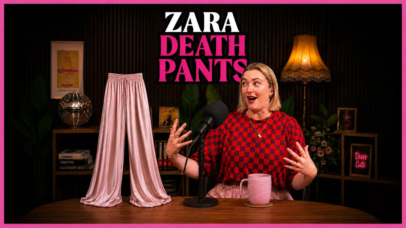 A blonde woman with a surprised expression sits at a table with a microphone next to a pair of standing pink satin pants, with "ZARA DEATH PANTS" text above them.