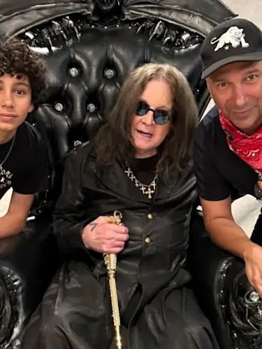 Tom Morello, Ozzy Osbourne and Roman Morello pose for the camera.