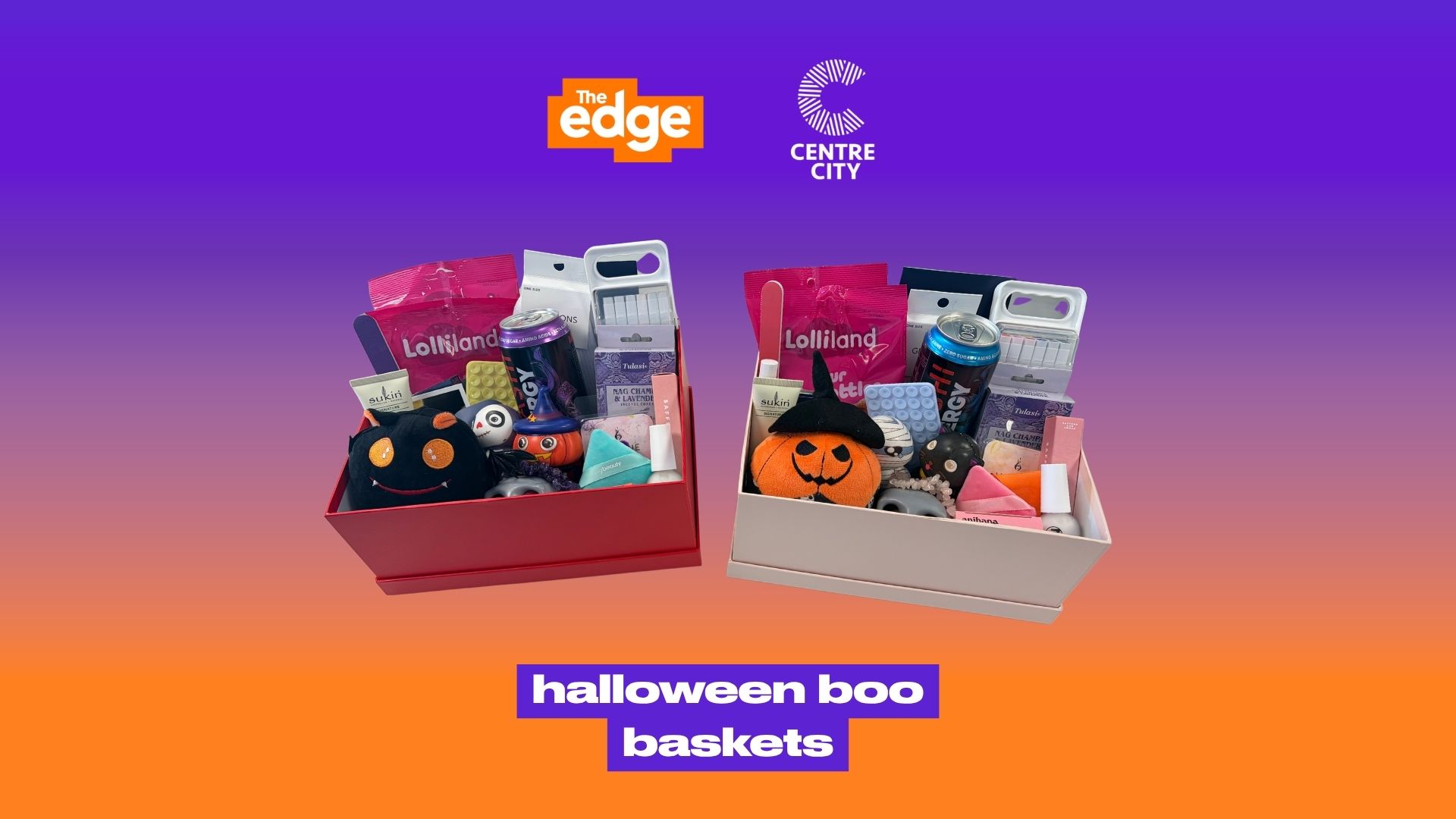 Two open gift baskets, one red and one light, filled with Halloween-themed plush toys, candy, energy drinks, and beauty products, on a purple to orange background with 'The Edge' and 'Centre City' logos, and 'halloween boo baskets' text.