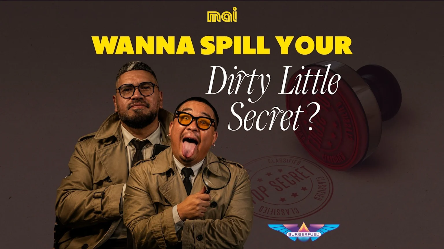 Two men dressed as detectives, one serious and one playful with a magnifying glass, next to the text "Wanna Spill Your Dirty Little Secret?", with Mai and BurgerFuel logos.
