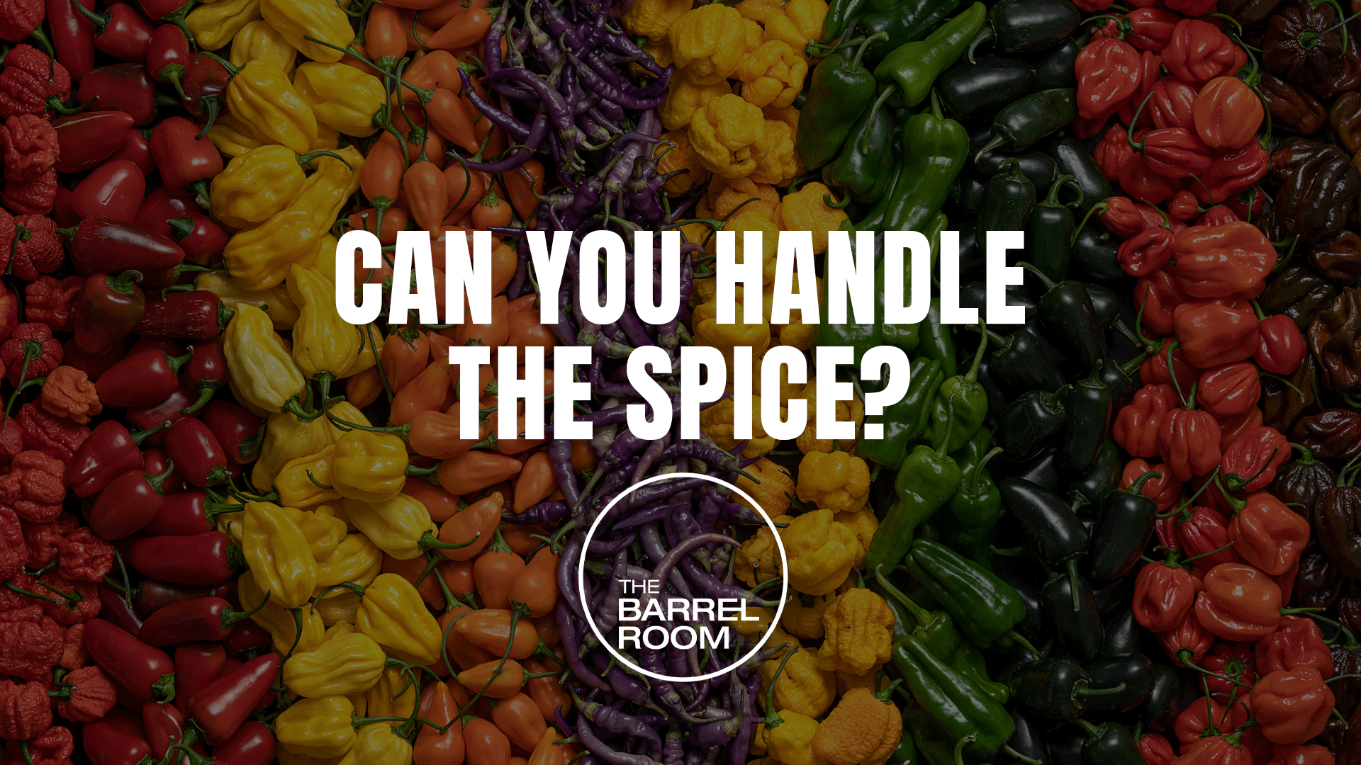 A colorful array of chili peppers in shades of red, yellow, orange, purple, and green, with text "CAN YOU HANDLE THE SPICE?" and "THE BARREL ROOM" overlaid.