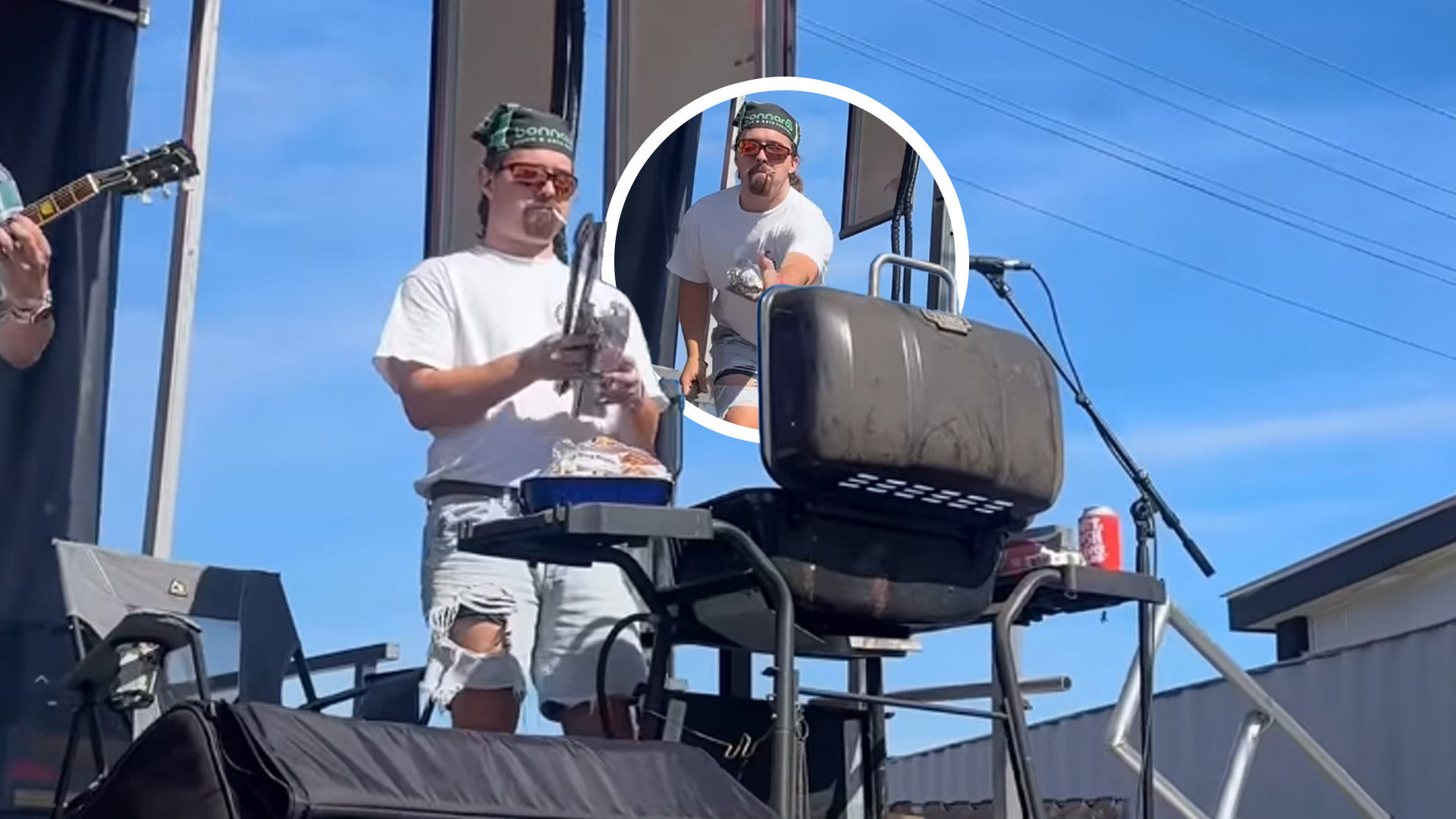 Man on stage cooking up hotdogs
