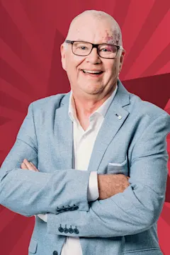 Murray Lindsay smiling against a starry red background