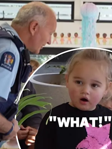 A New Zealand police officer leaning over a shocked little girl with the text "what?"