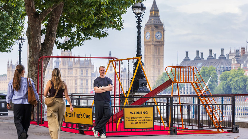 A man stands beside a closed playground with swings and a slide, displaying a sign warning "Kids bones are not strong enough to use it," with Big Ben in the background.