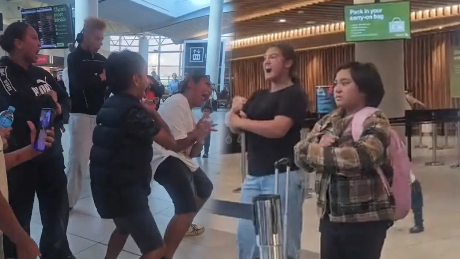 A group of people, mostly young, perform a haka with open mouths and dynamic arm movements in an airport, while a young girl in a plaid shirt and pink backpack watches.