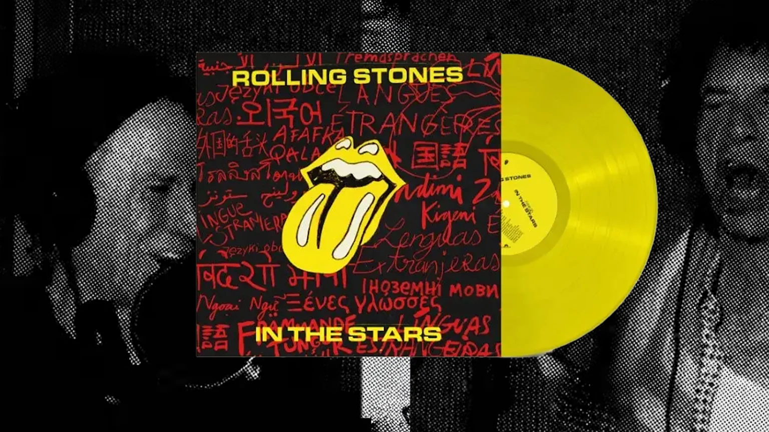 image of Rolling Stones In The Stars LP cover on top of a black and white image (with halftone effect) of Mick Jagger and Keith Richards singing in a studio.