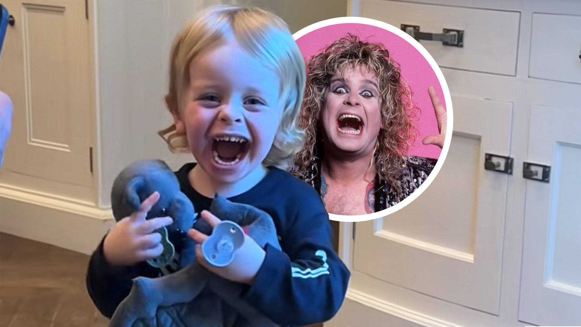 Ozzy's grandson smiling with toy bat in his hands