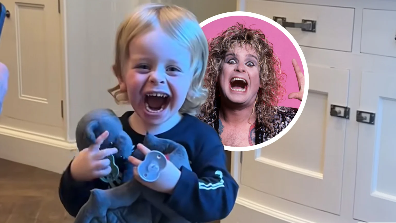 Ozzy's grandson smiling with toy bat in his hands