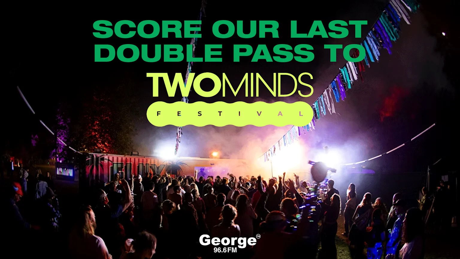 A lively night view of the Twominds Festival with a large crowd, bright lights, banners, and the text "SCORE OUR LAST DOUBLE PASS TO TWOMINDS FESTIVAL" along with "George 96.6 FM".