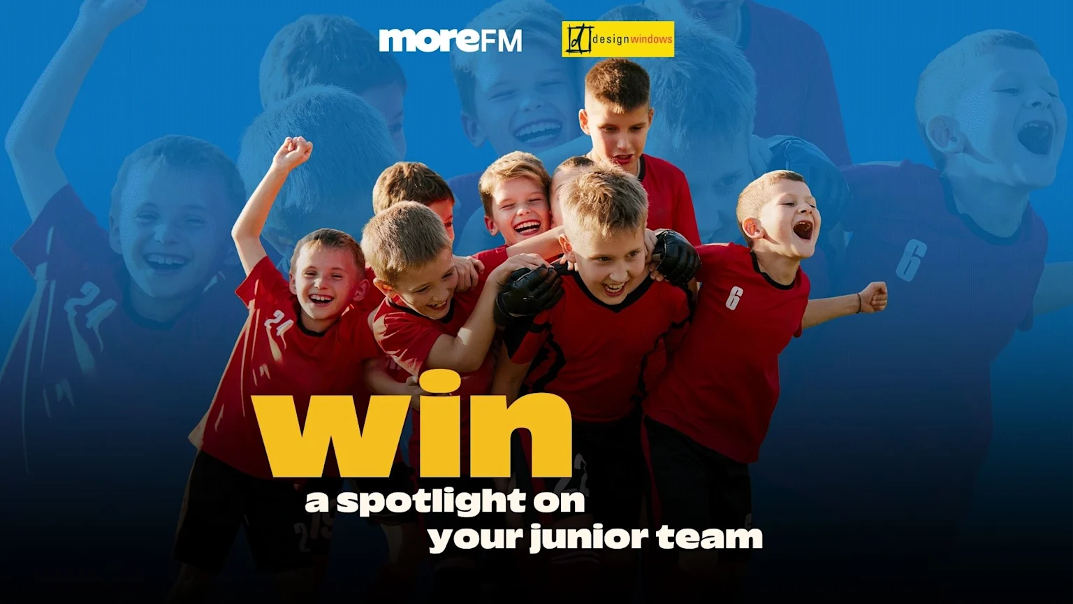 A group of joyful junior soccer players in red jerseys huddle and celebrate, with "moreFM" and "designwindows" logos and promotional text "win a spotlight on your junior team."
