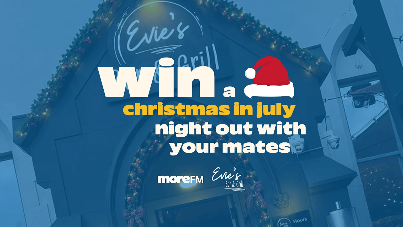 An advertisement on a building for "Evie's Bar & Grill" says "Win a christmas in july night out with your mates" in white and yellow text, featuring a red Santa hat and Christmas lights.