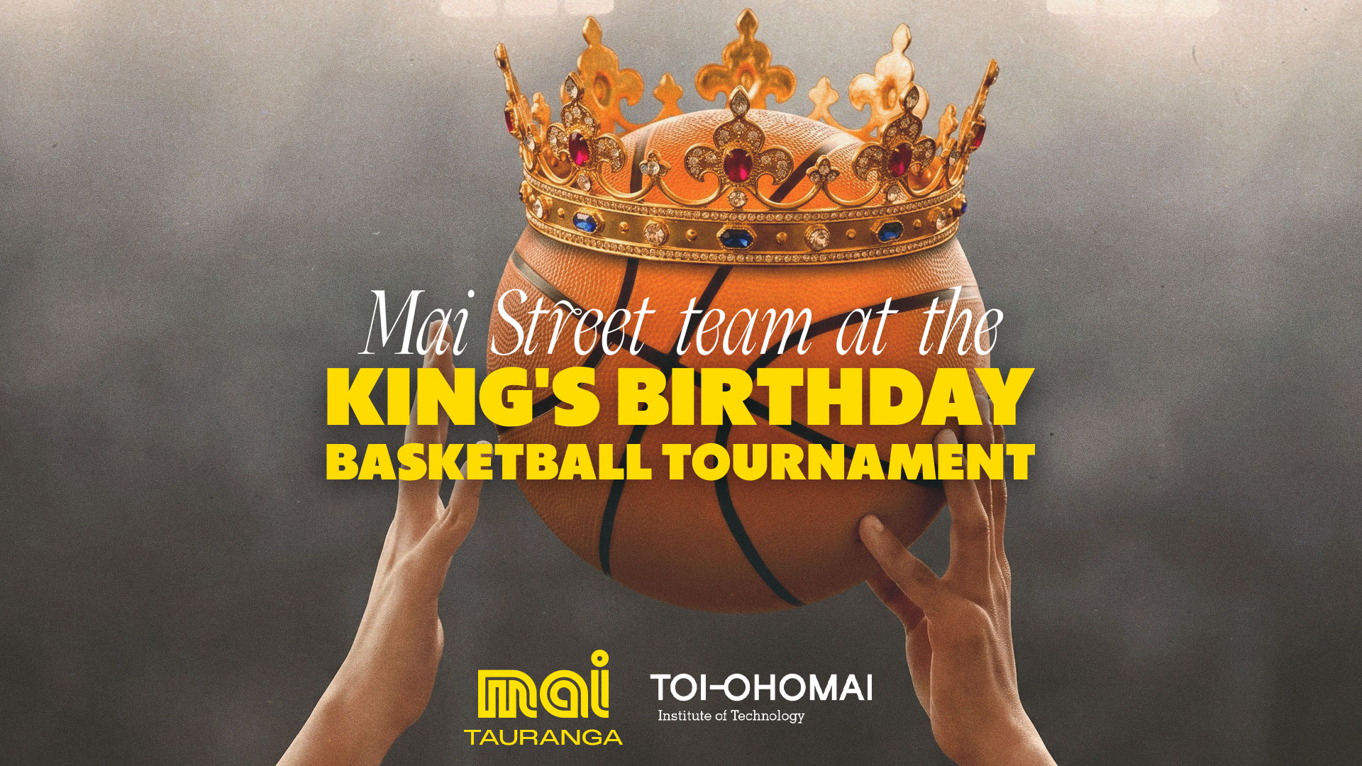 Two hands hold a basketball topped with a gold crown, featuring the text "Mai Street team at the King's Birthday Basketball Tournament" and institutional logos.