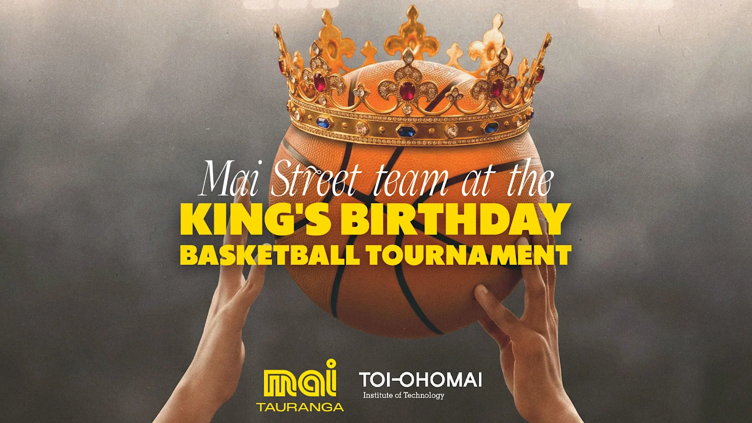 Two hands hold a basketball topped with a gold crown, featuring the text "Mai Street team at the King's Birthday Basketball Tournament" and institutional logos.