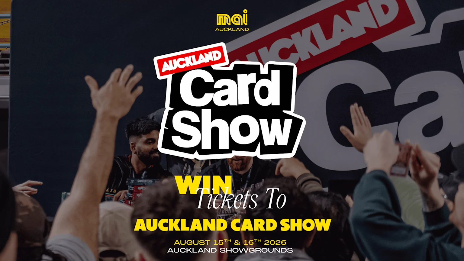Attendees at the Auckland Card Show event with hands raised, featuring prominent text overlays promoting the 'Auckland Card Show' for August 15th & 16th 2026 and encouraging ticket wins.