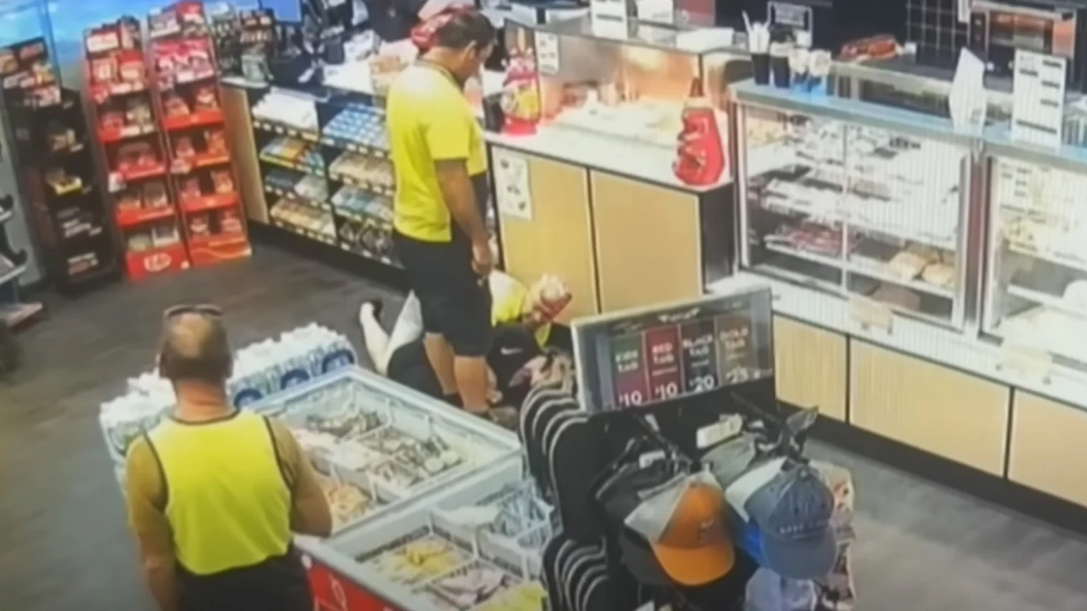 CCTV footage of a tradie tackling a robber to the ground.