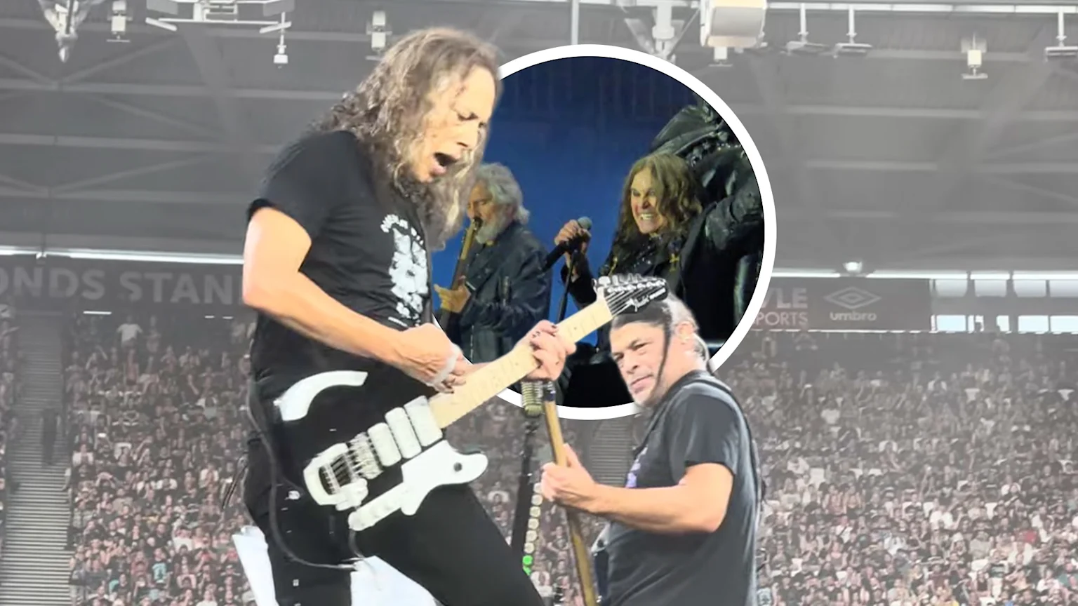 Kirk Hammett and Robert Trujillo performing live on stage.