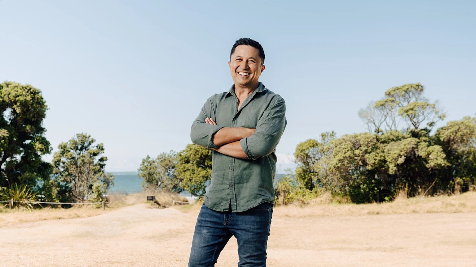 Mike Puru standing with trees in background