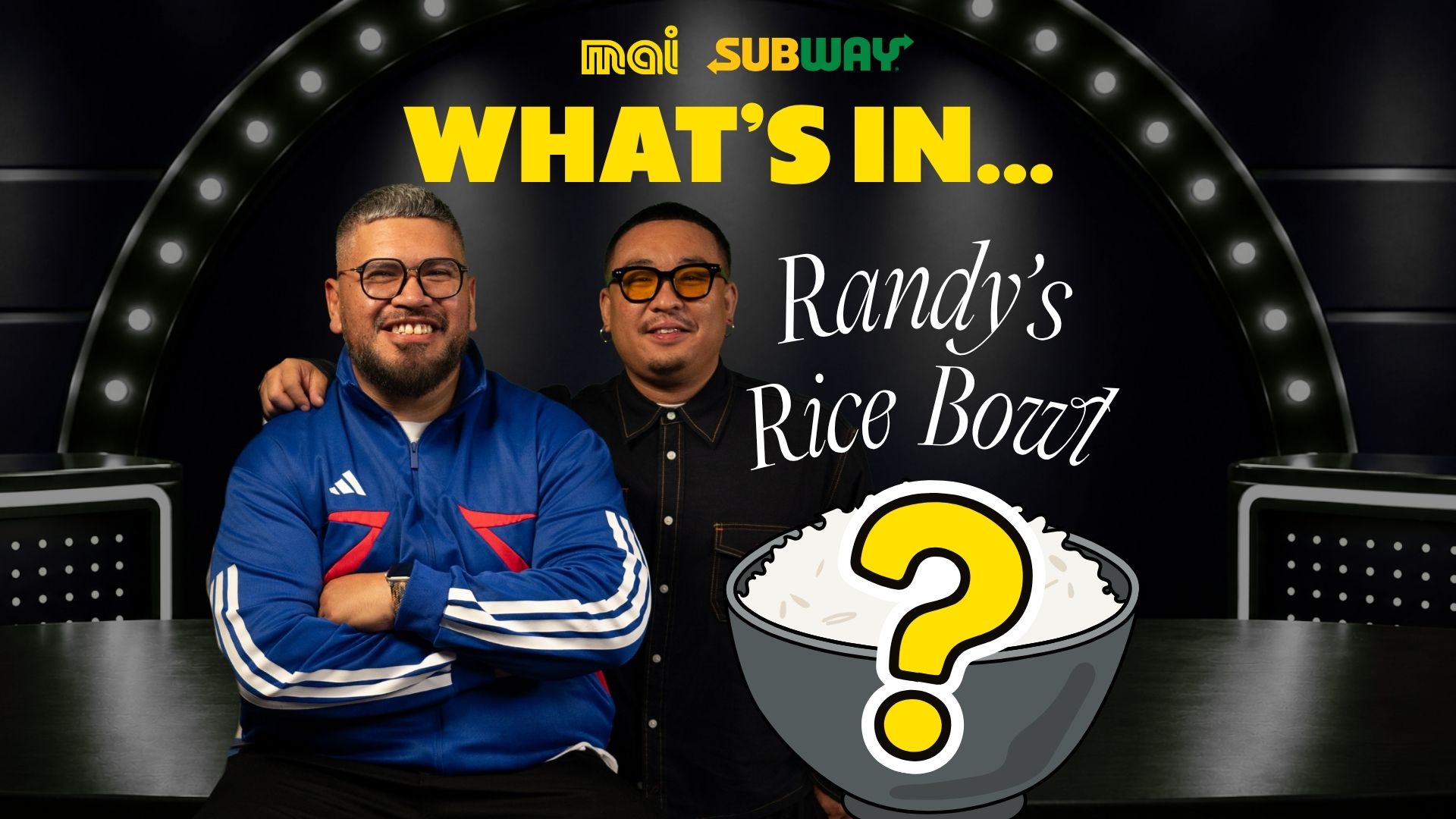 Two smiling men on a game show set with Mai and Subway logos, featuring text 'WHAT'S IN... Randy's Rice Bowl' and a cartoon rice bowl with a question mark.