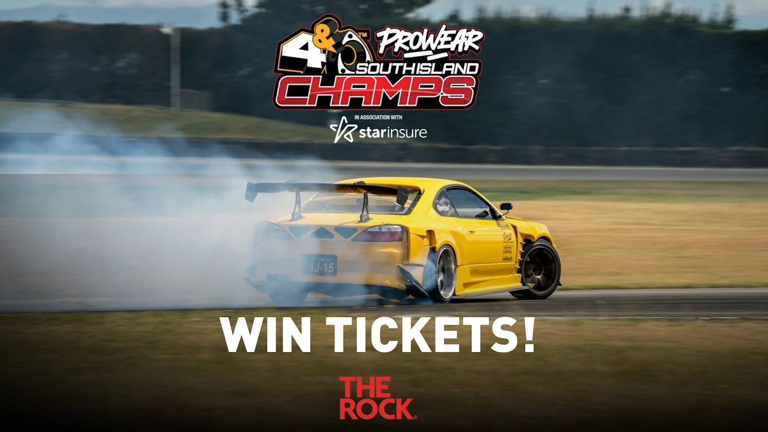 A yellow drift car produces thick smoke on a race track, with event logos "4 & Prowear South Island Champs," "starinsure," "WIN TICKETS!", and "THE ROCK" visible.