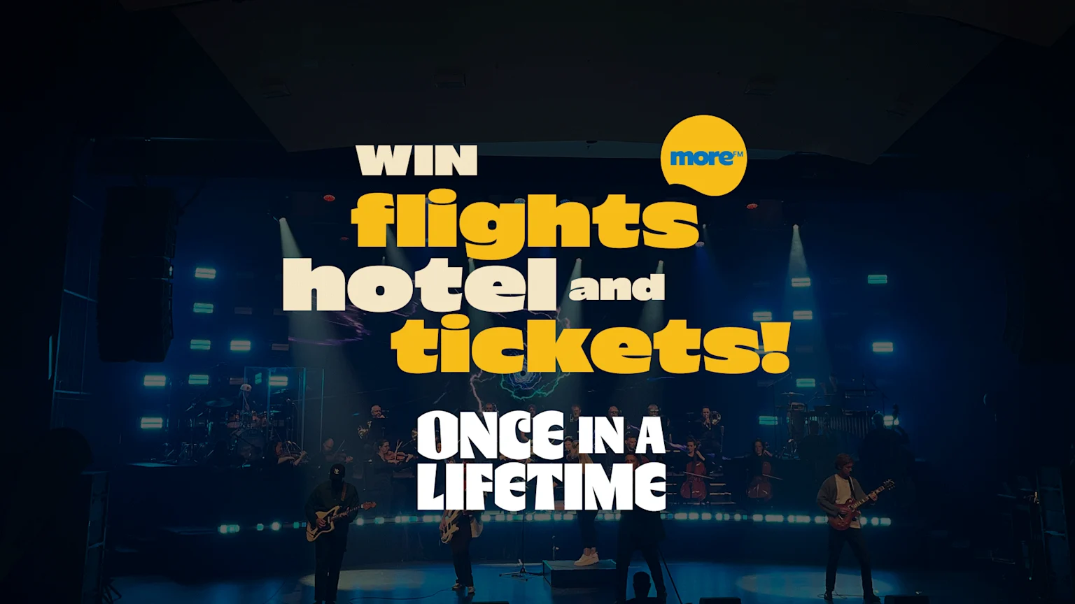 A music band performs on a dark stage with blue lights, overlaid with large text "WIN flights hotel and tickets! ONCE IN A LIFETIME" and a "more™" logo.