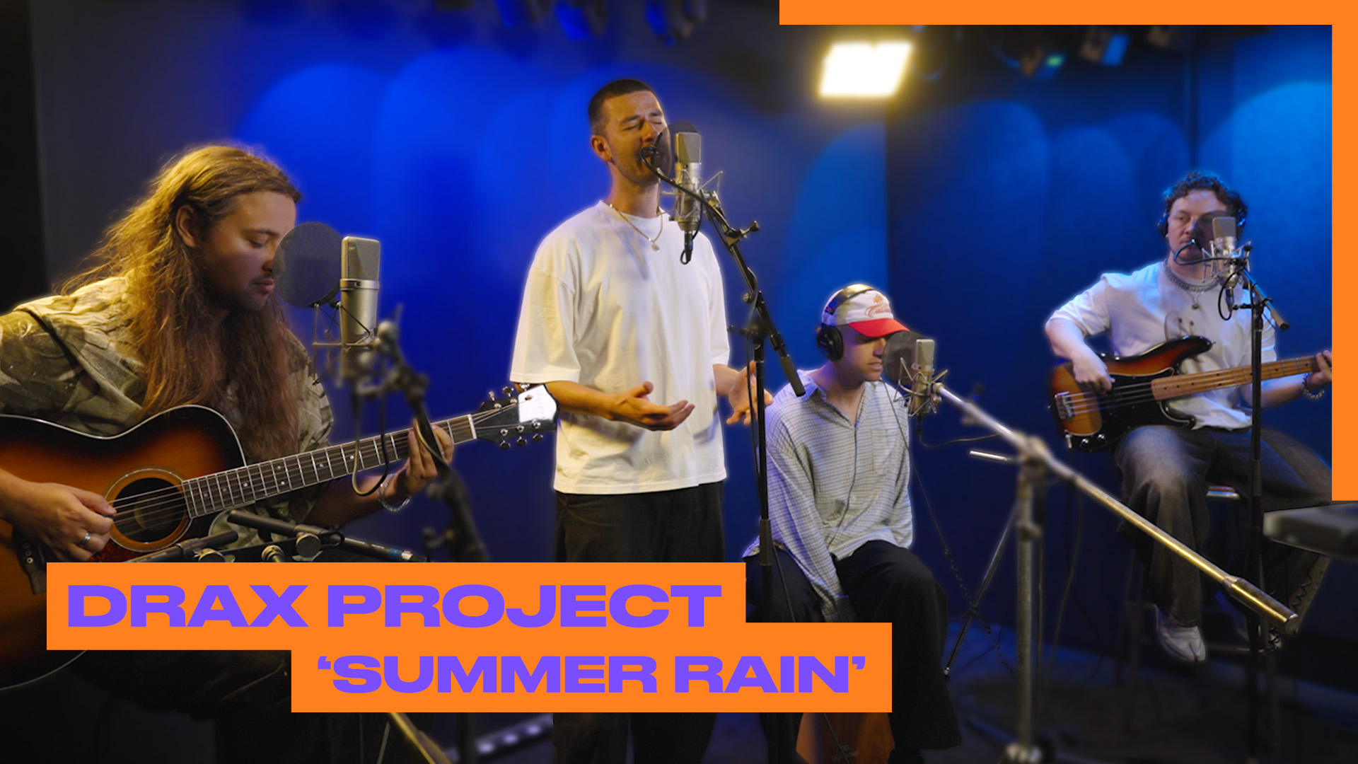 Band performing in blue-lit studio