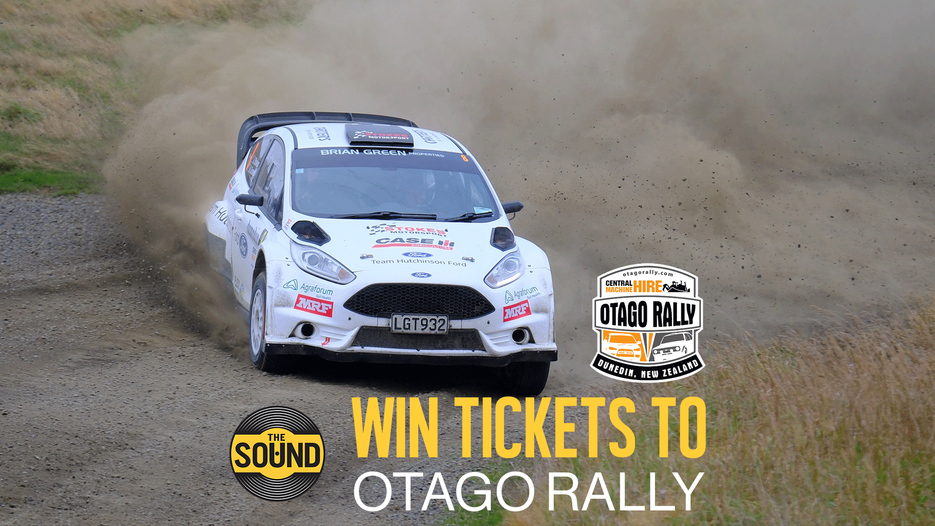A white rally car kicks up dust while speeding on a gravel road, with overlaid text "WIN TICKETS TO OTAGO RALLY" and event logos.