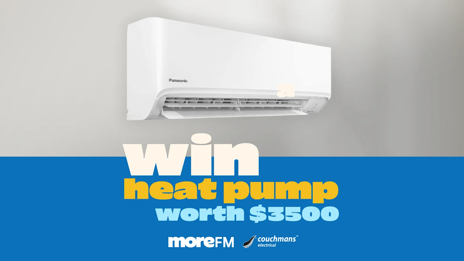 A white Panasonic heat pump is mounted on a light gray wall above a blue section with text reading "win heat pump worth $3500" and logos for moreFM and couchmans electrical.