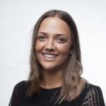 Woman with long hair smiling at camera