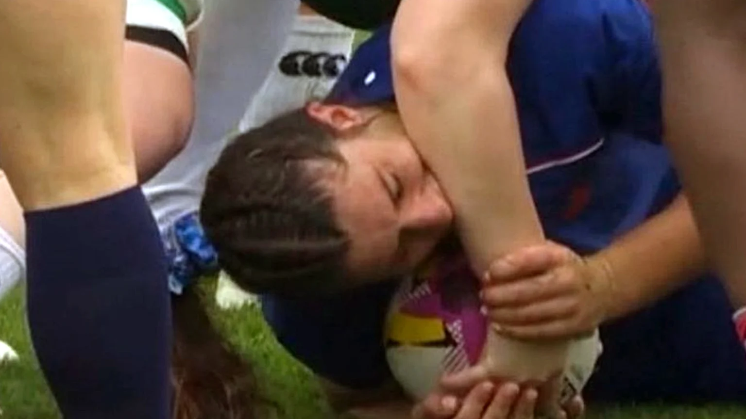 France women's rugby flanker Axelle Berthoumieu biting Irish player Aoife Wafer's arm during the Women's Rugby World Cup quarter final.