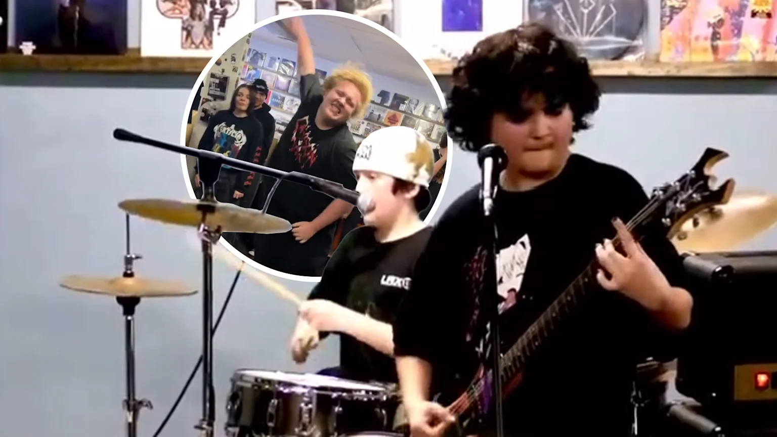 A young guitarist with dark curly hair plays an electric guitar at a microphone, next to a drummer; a circular inset shows other enthusiastic young band members in a room filled with records.