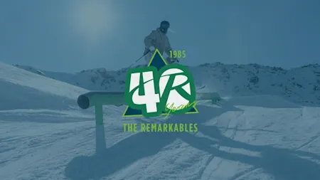 Person skiing over a pipe at The Remarkables. Logo overlayed on top, in center of "40 Years of The Remarkables"