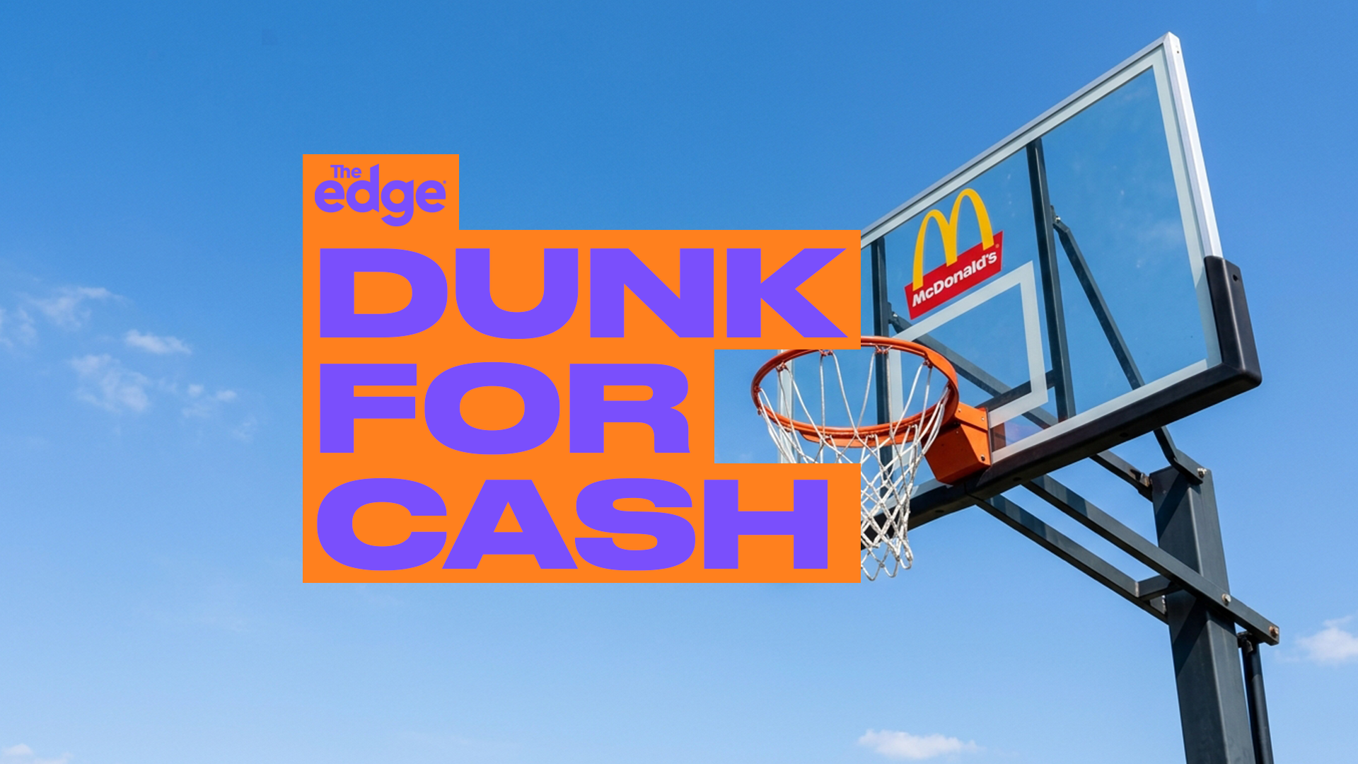 A basketball hoop with a McDonald's logo on the backboard is partially covered by a large orange graphic with purple text that reads "The edge DUNK FOR CASH," all against a blue sky.