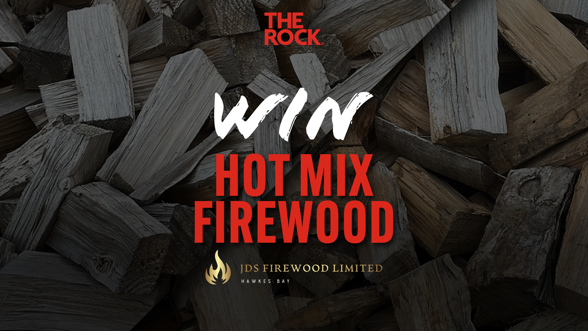 An image of stacked firewood with text overlay: 'THE ROCK WIN HOT MIX FIREWOOD' and a golden flame logo followed by 'JDS FIREWOOD LIMITED HAWKES BAY'.