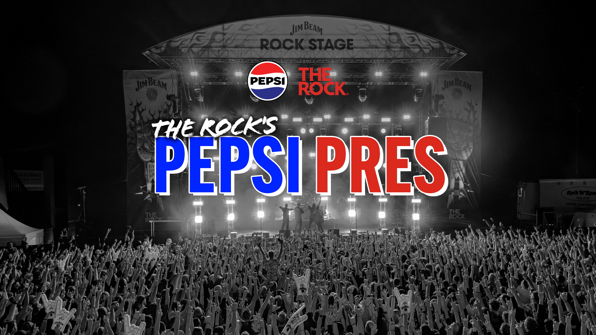 An outdoor nighttime concert scene with a large crowd raising hands including foam 'rock on' gestures. The brightly lit stage features performers wearing dark clothing and prominent banners of Jim Beam and The Rock. Overlaid promotional text includes 'THE ROCK'S PEPSI PRES', with Pepsi and The Rock logos in color against a mostly black and white background.